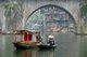 China: Boatmen in front of the mist covered Hong Qiao Bridge, Fenghuang's famed covered bridge, Fenghuang, Hunan Province